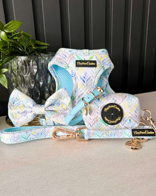 Dog harness for small dogs, step in harness, leash, and bow tie set with floral pattern on a neutral background